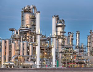 A large factory with many pipes and tanks